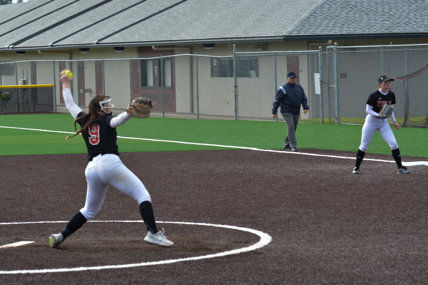 Sophomore pitcher Madisyn Erickson delivers a pitch during the senior night game against Capital High School on May 9.