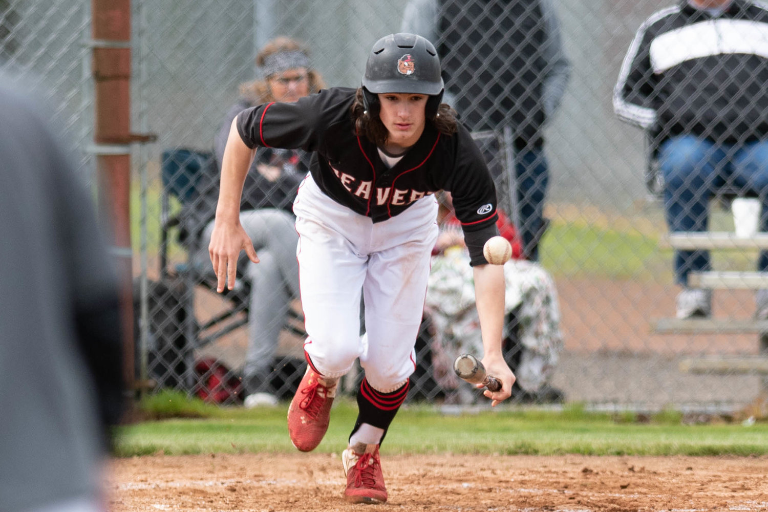 Tenino's Brody Noonan looks to run after laying down a bunt against Eatonville in the 1A District 4 playoffs at Castle Rock May 13.