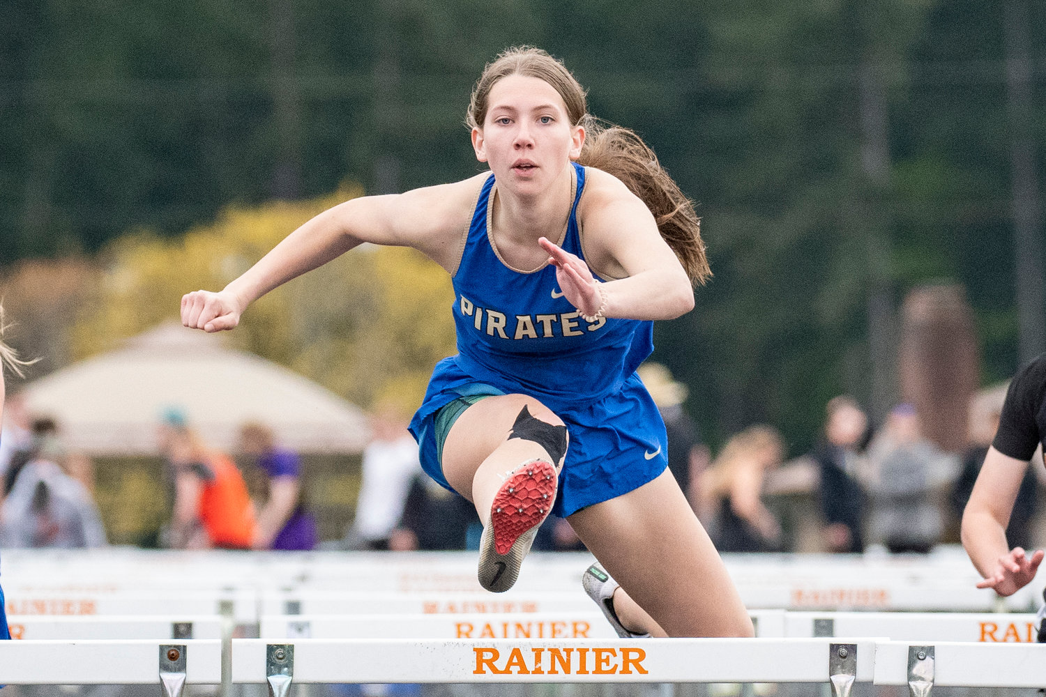 Adna's Faith Wellander competes in the girls 100-meter hurdles at the Central 2B League championships in Rainier on May 13.