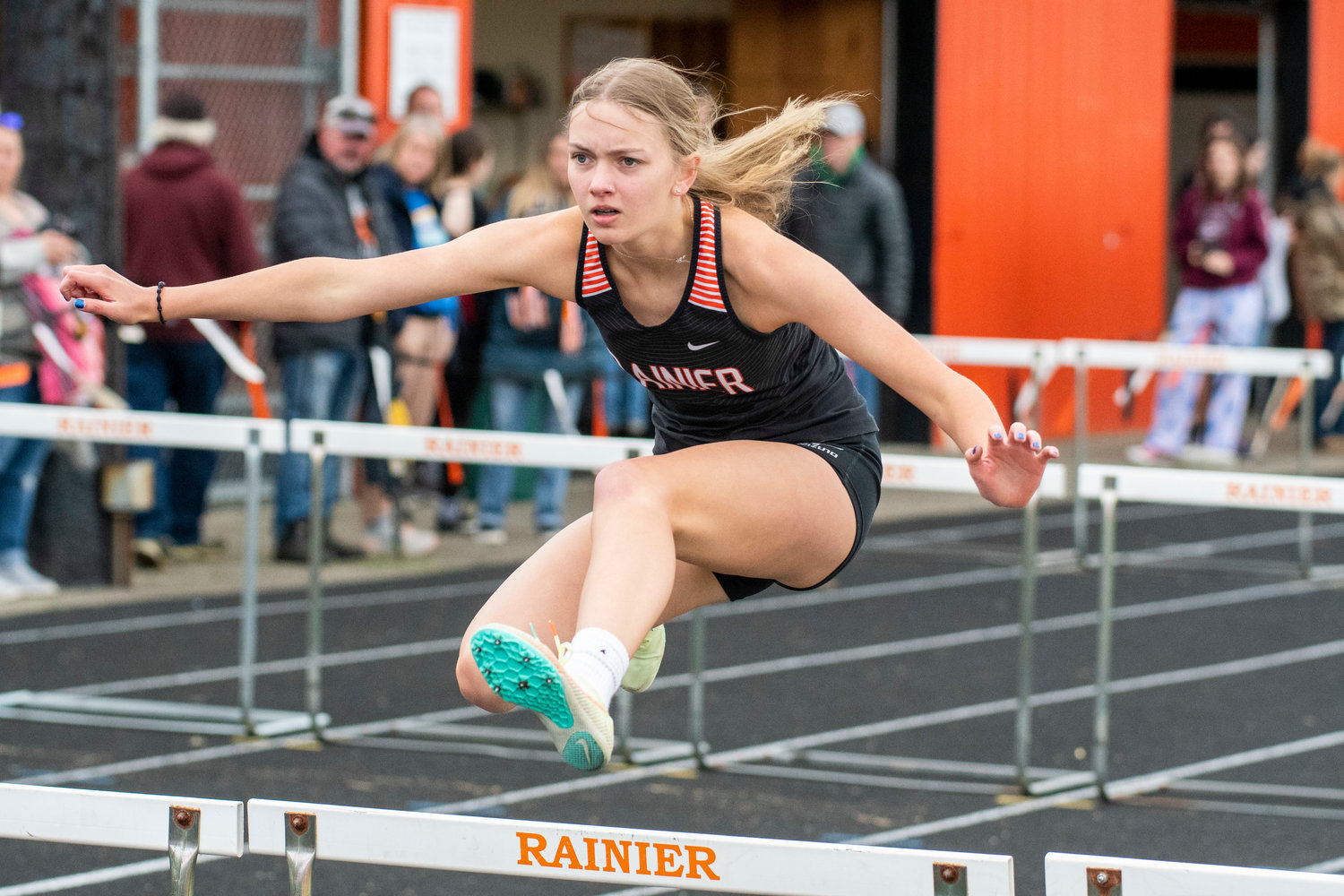 Rainier's Emma Mathson competes in the 100-meter hurdles at the Central 2B League Championships in Rainier on May 13.