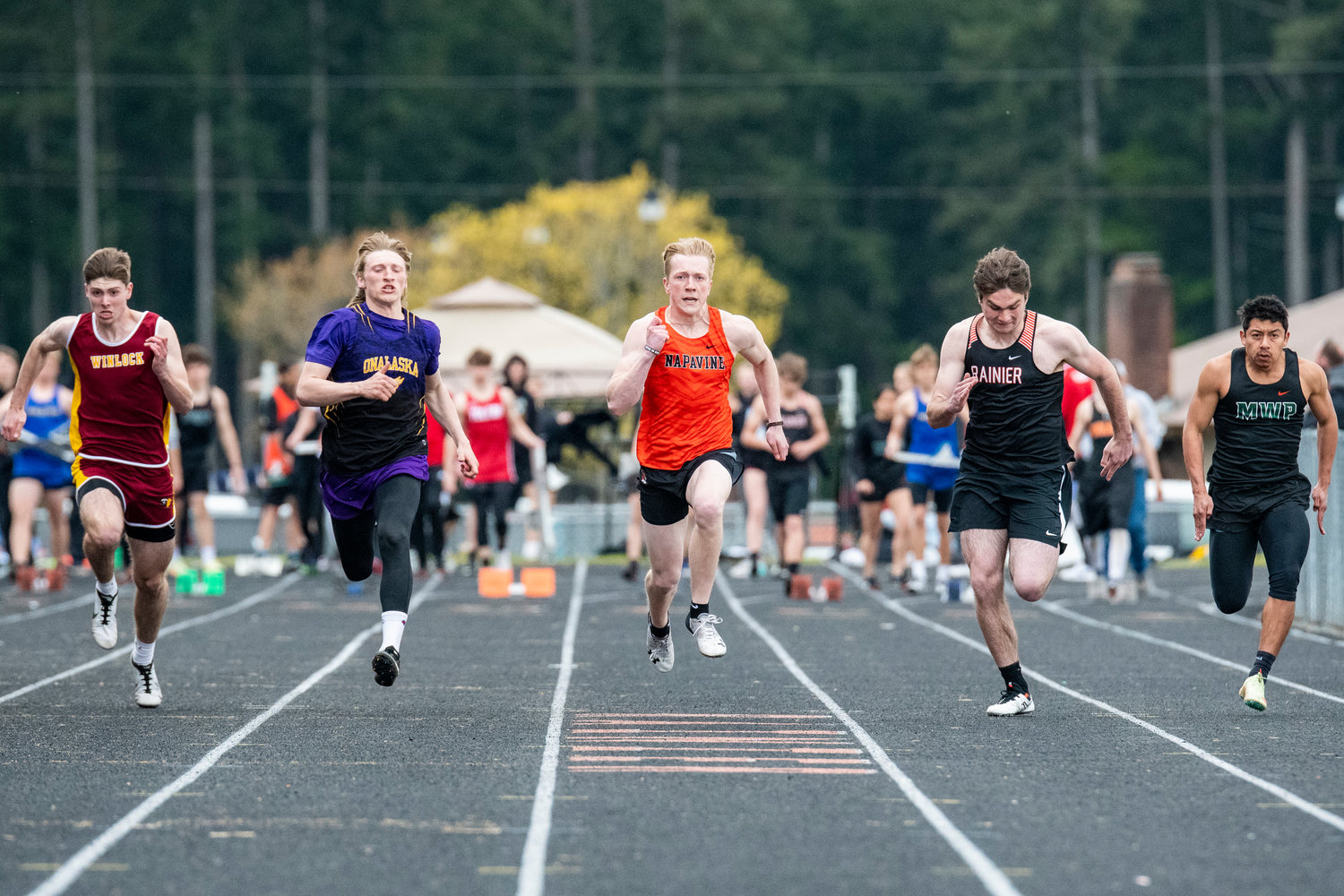 From left, Winlock's Payton Sickles, Onalaska's Kole Taylor, Napavine's Lucas Dahl, Rainier's Harbor Lee and Morton-White Pass' David Martinez, compete in the boys 100-meter dash at the Central 2B League Championships in Rainier on May 13.