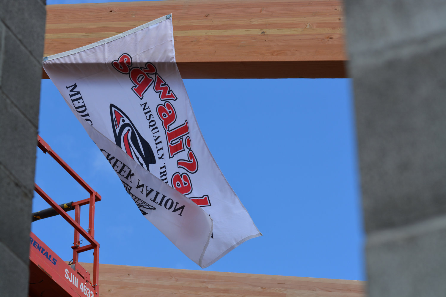 The Nisqually Tribe's flag is pictured at a "topping out" ceremony on its Elder Center on May 19.