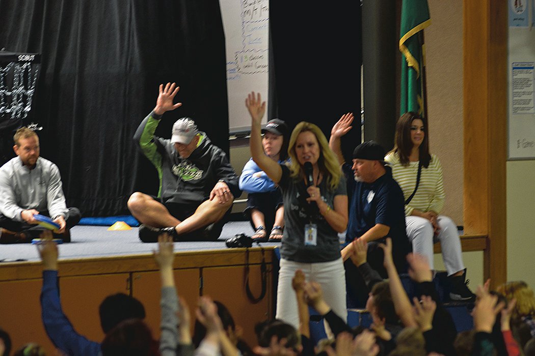 Principal Deb McLaren gets her students to actively participate in a school assembly on May 20.