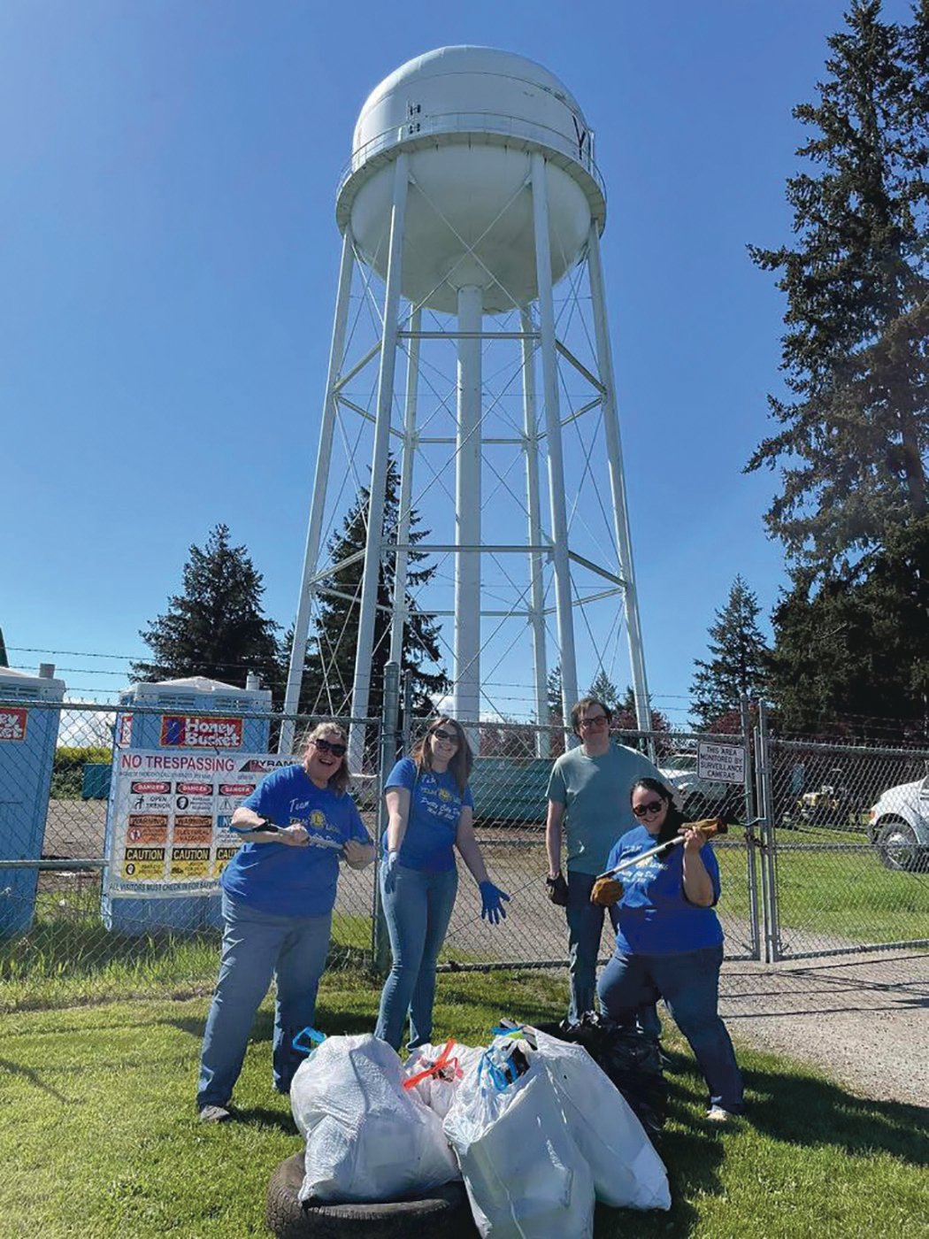 Members of the Yelm Lions Club show the trash they collected on May 21.