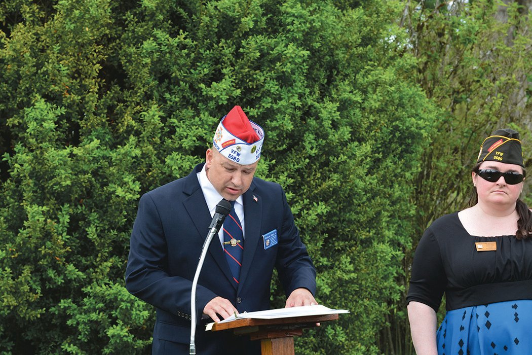 Frank Persa, commander of the VFW in Yelm, addresses those in attendance at a Memorial Day event in Roy.