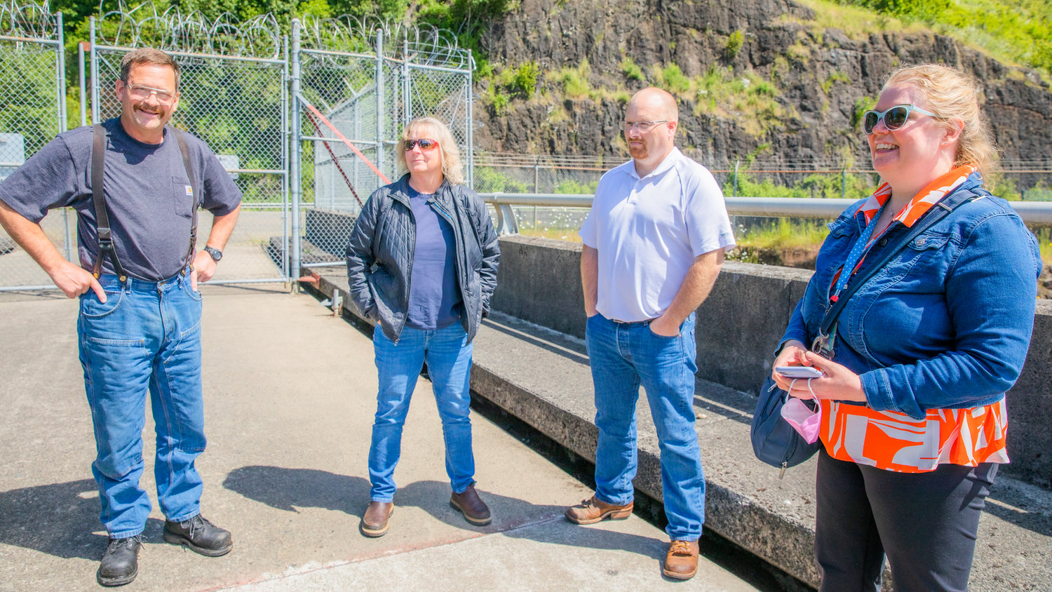 From left, Clarence Lupo, Kyrra Wilson, Chad Chalmers, and Monika Sundbaum stand on the Mossyrock Dam.
