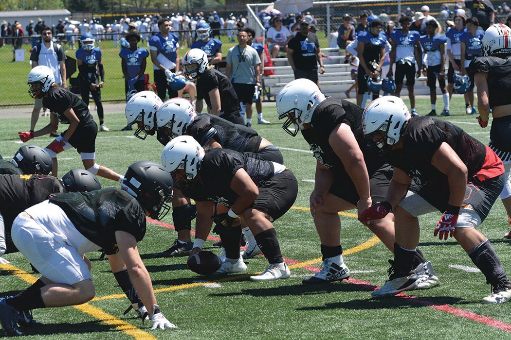Yelm’s offensive line awaits the snap against Lincoln High School during a camp at Pacific Lutheran University.