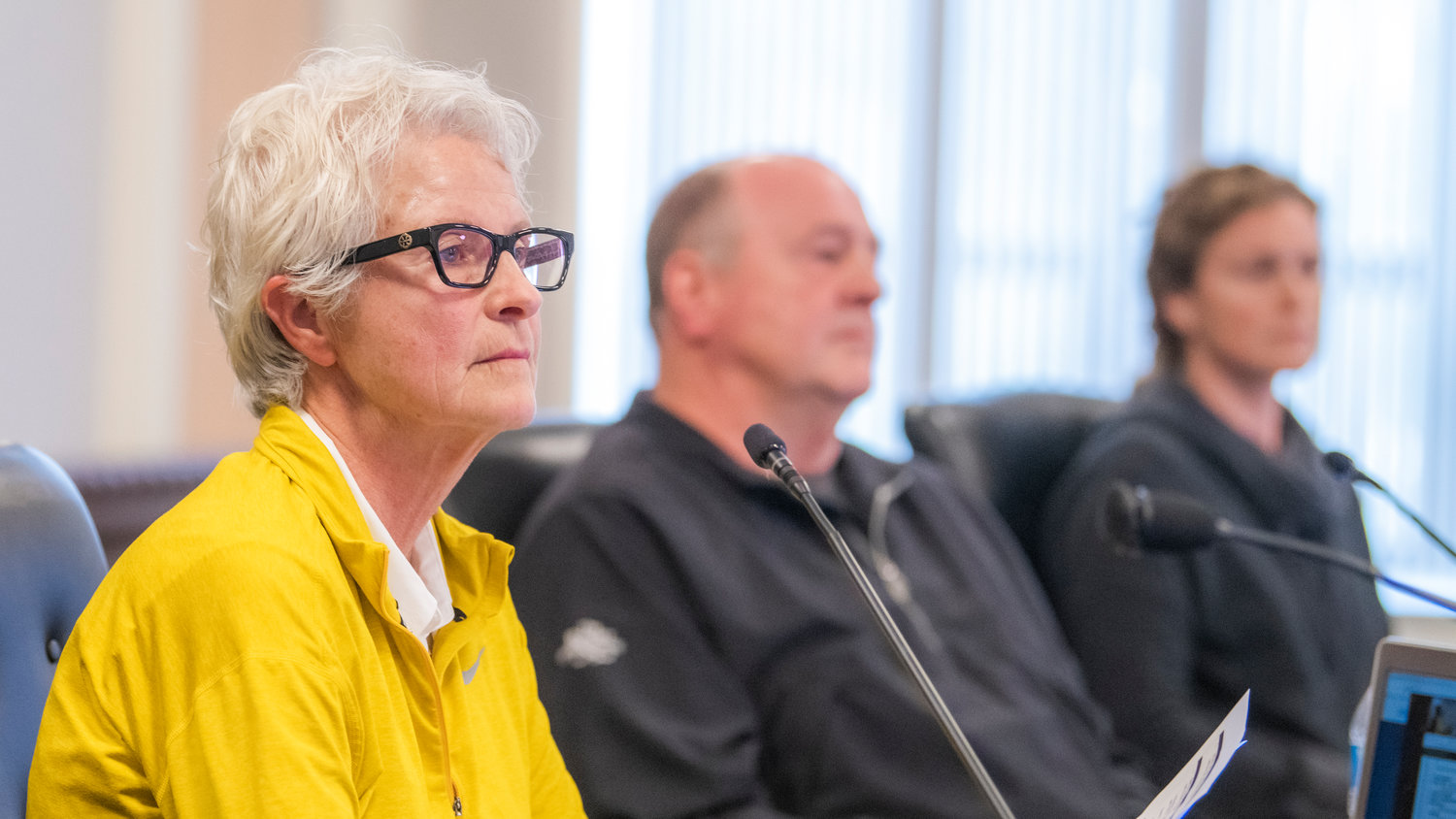 Lewis County Planning Commissioners Lorie Spogen, Bob Russell and Gretchen Fritsch listen to public comments about a rezone proposal on YMCA land north of Mineral Lake in the Lewis County Courthouse Tuesday.