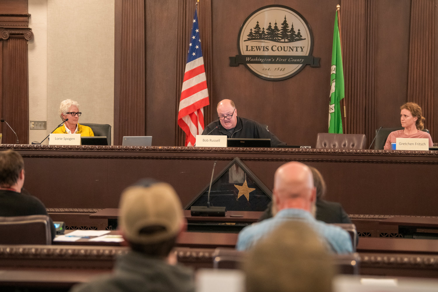 Lewis County Planning Commissioners Lorie Spogen, Bob Russell and Gretchen Fritsch workshop a rezone proposal on YMCA land north of Mineral Lake in the Lewis County Courthouse Tuesday.