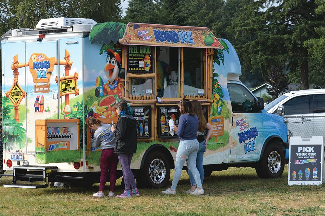 People at the Retro Rainier Independence Day Celebration on July 2 were treated to shaved ice at the Kona Ice vendor, which featured 10 flavors.