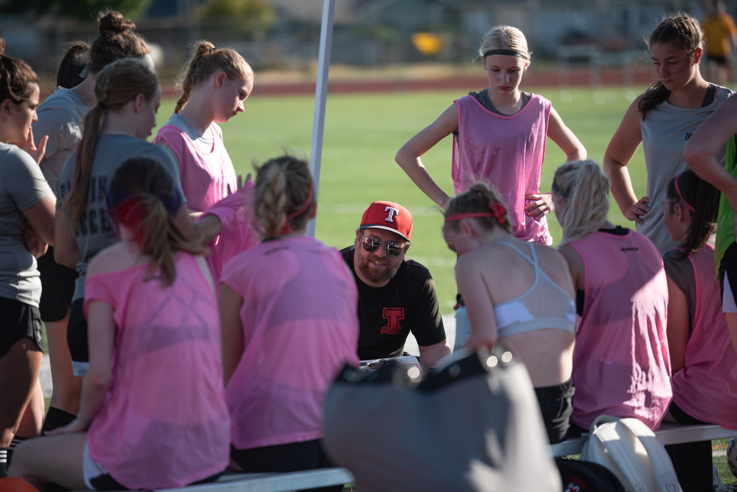 Tenino head coach Dave Montgomery talks with his team during a break against Centralia in a scrimmage at Tiger Stadium Thursday.
