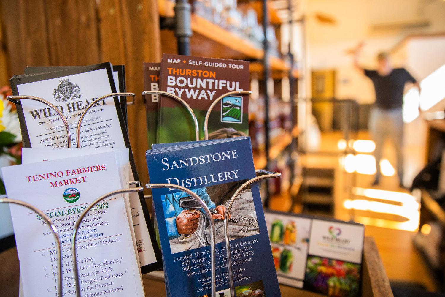 Local flyers are displayed inside the Sandstone Distillery Tasting Room in downtown Tenino on Thursday.