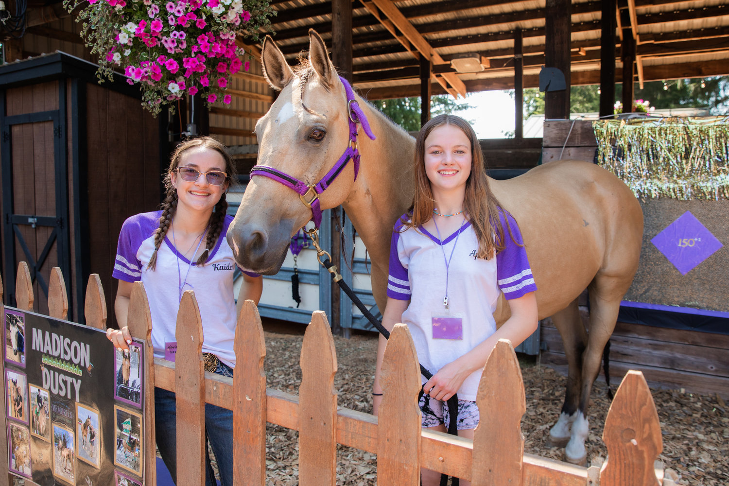 Kaidence Yancey and Anna Mills smile for a photo with Dusty, an American Quarter Horse,  at the Thurston County Fair on Thursday, July 28.