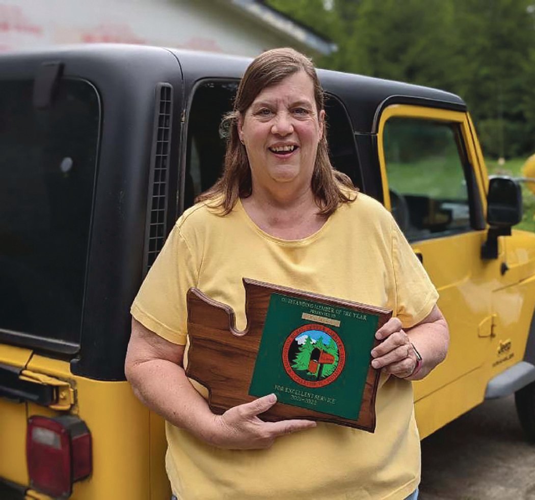 Kris Skewis poses with her award from the Washington Rural Letter Carriers’ Association