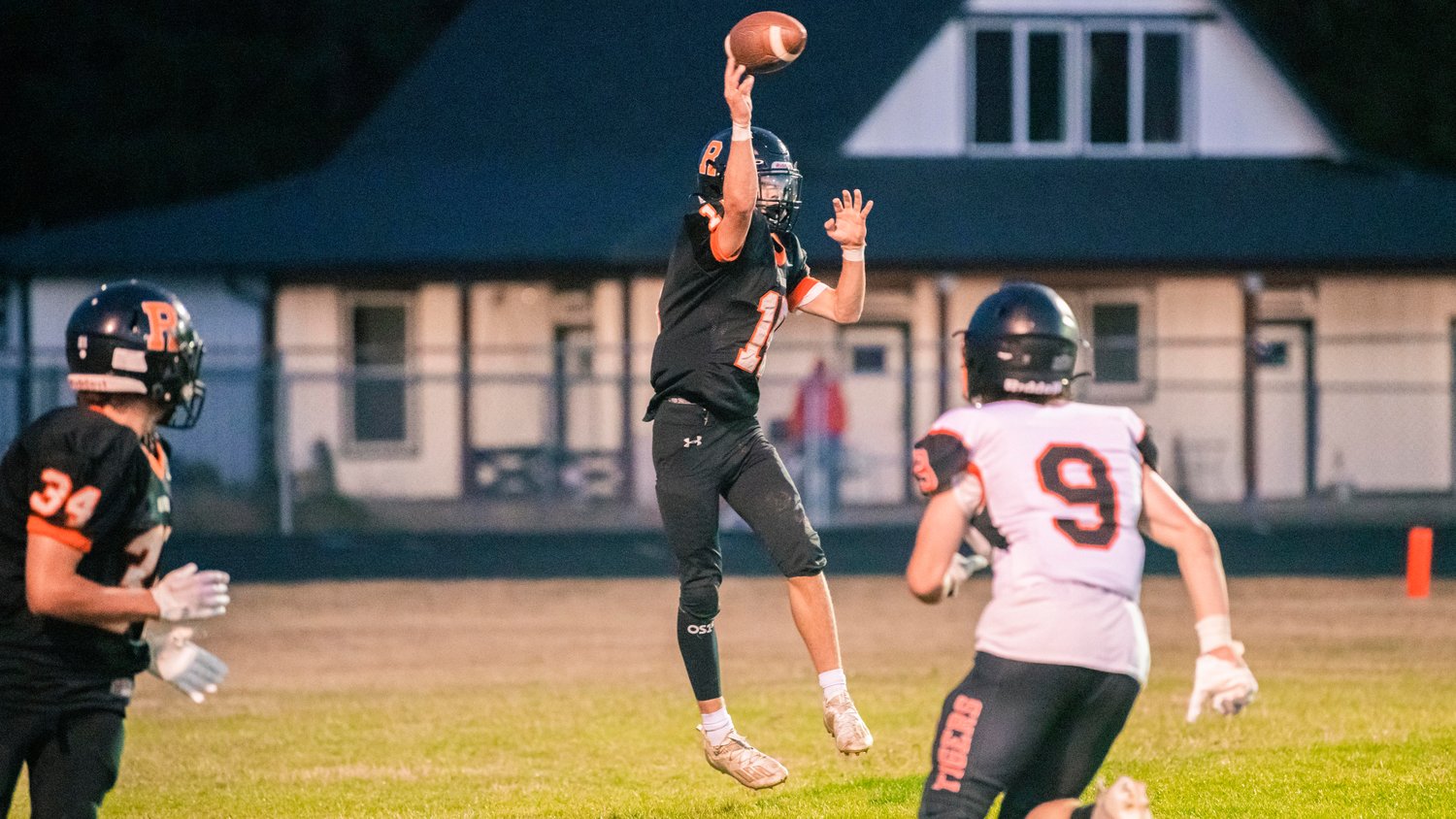Rainier quarterback Jake Meldrum (15) leaps and throws a pass during a game Friday night.