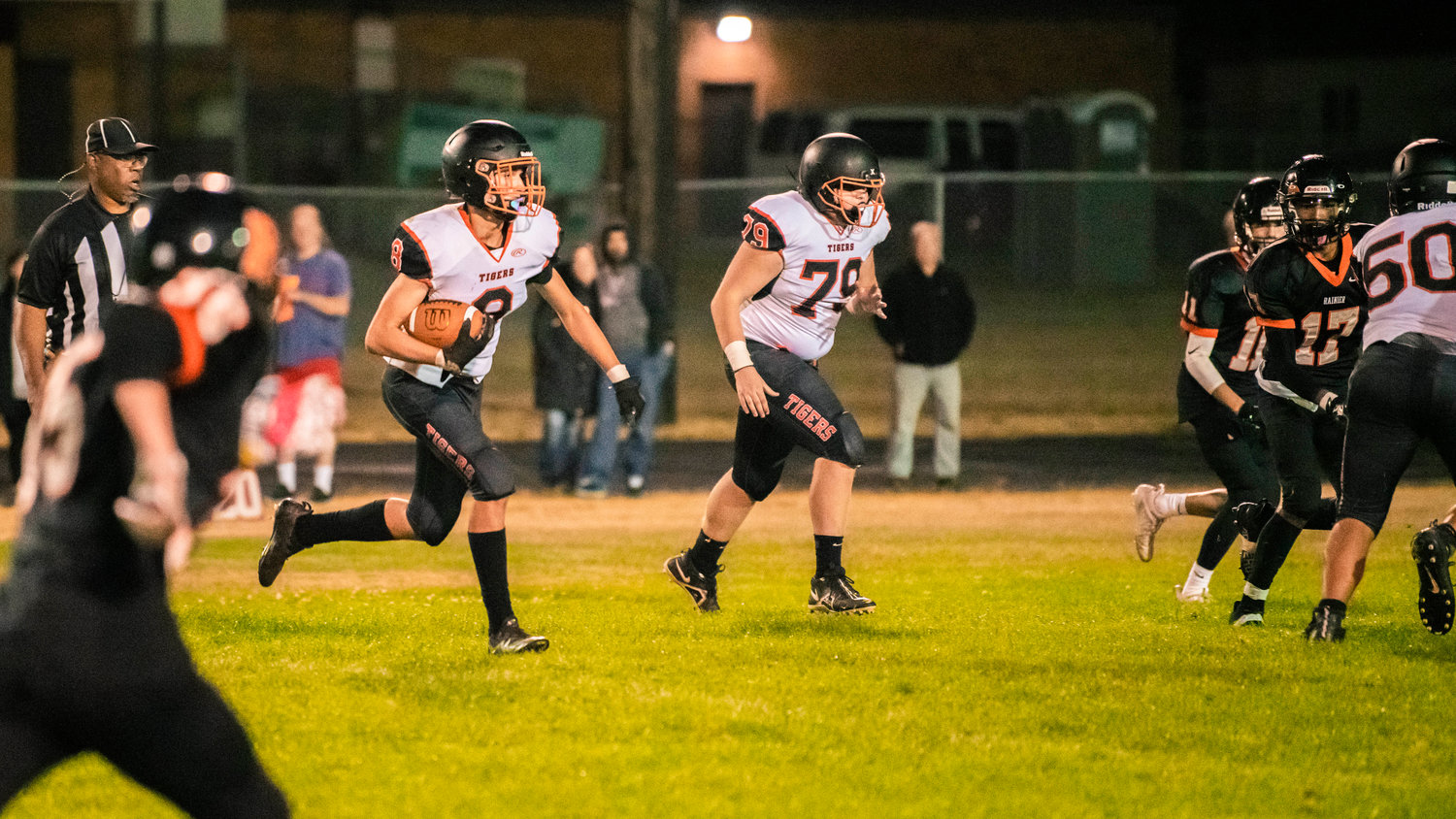 Napavine junior James Grose (8) runs with the football during a game Friday night in Rainier.