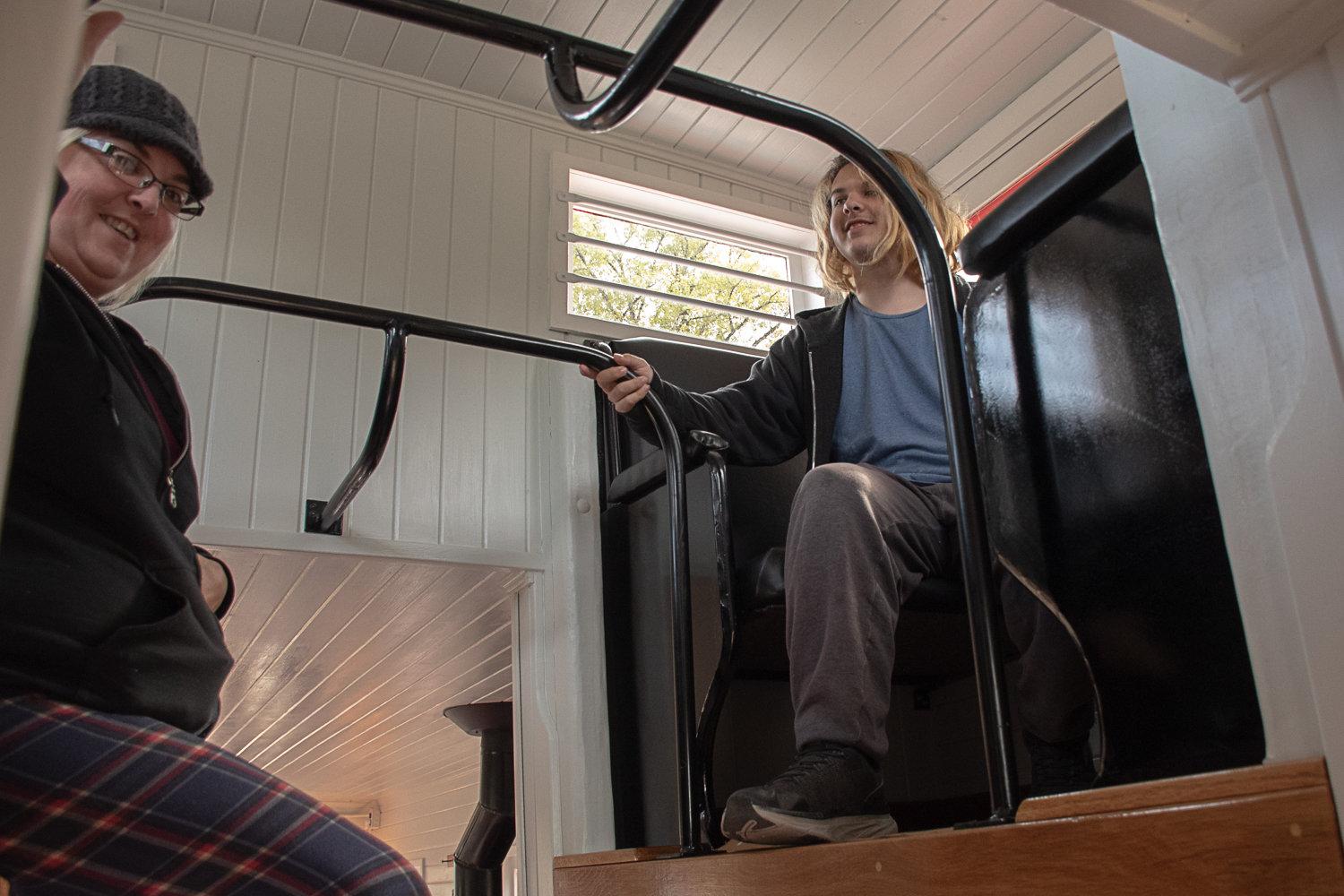 Samantha Burgess and her son, Orion Connon, explore the cupola on the newly restored caboose at the Tenino Depot Museum at the Tenino Railroad Day festival.