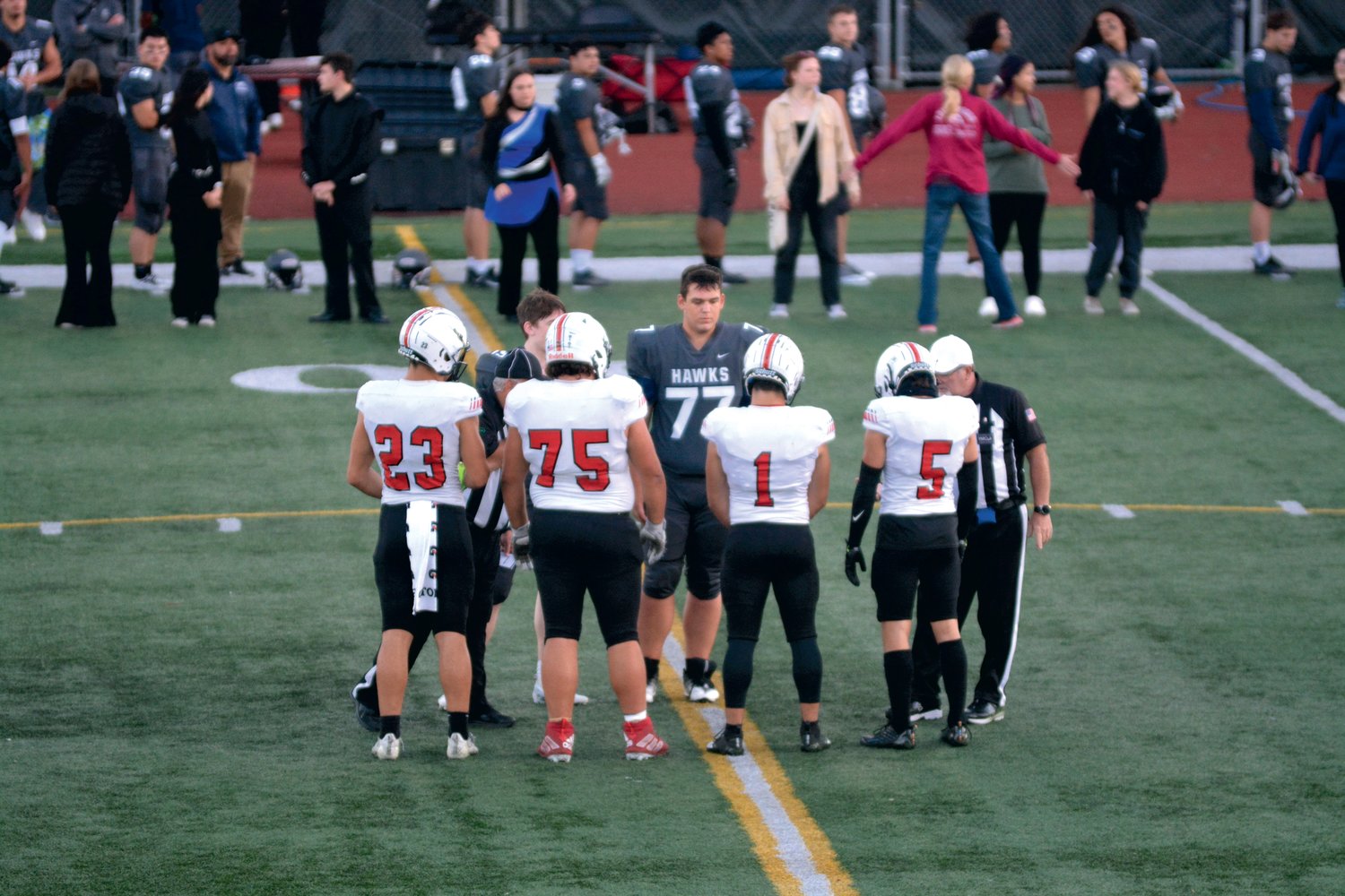 Yelm’s captains take to the middle of the field for the pre-game coin toss.