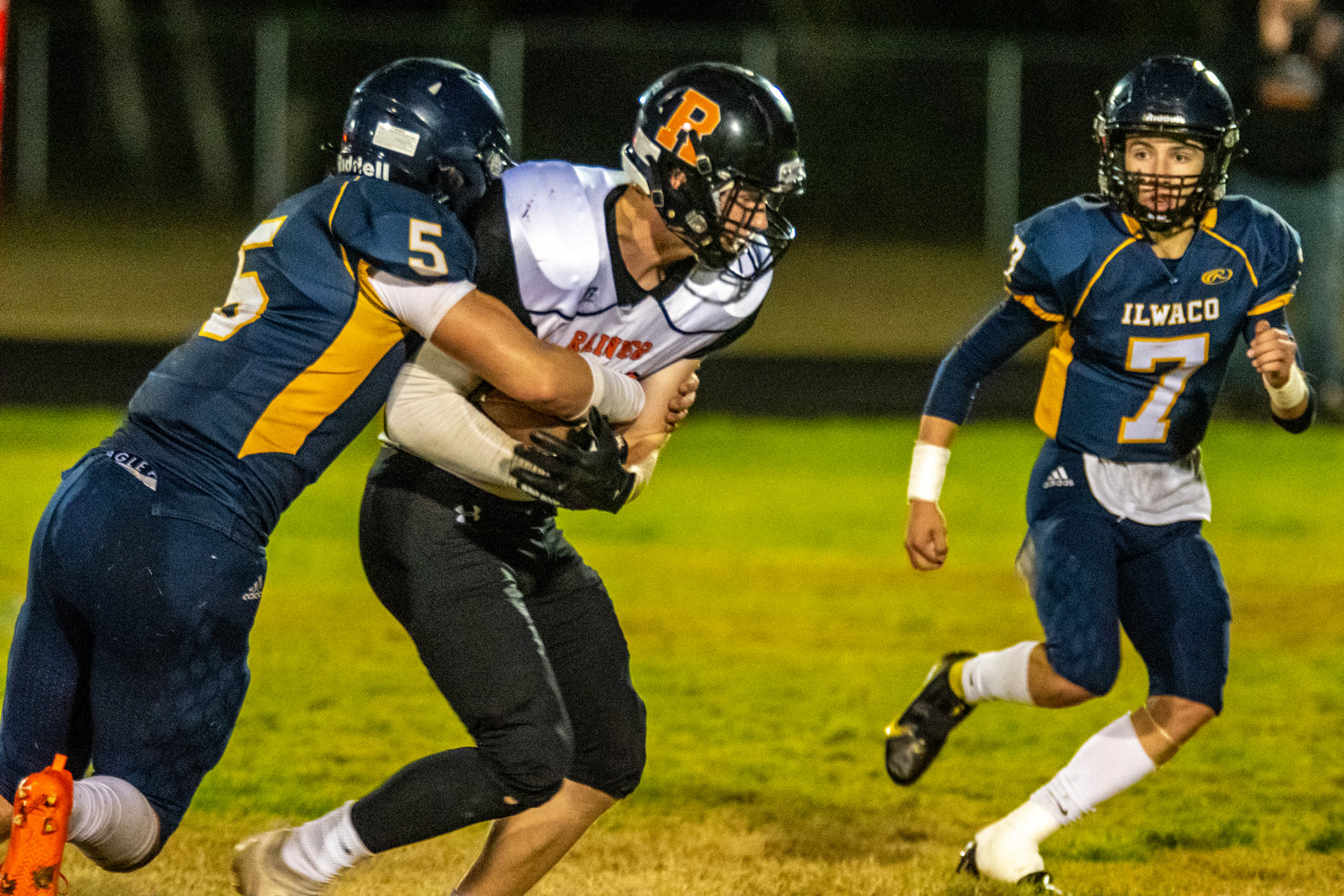 Rainier's John Kenney looks to break a tackle after hauling in a pass during a road game against Ilwaco on Sept. 30.