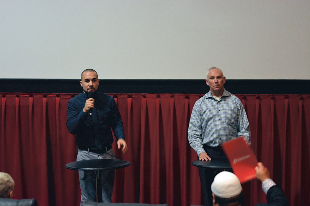 Derek Sanders, left, and John Snaza, right, speak at the “meet the candidates” town hall at Yelm Cinemas on Oct. 10.