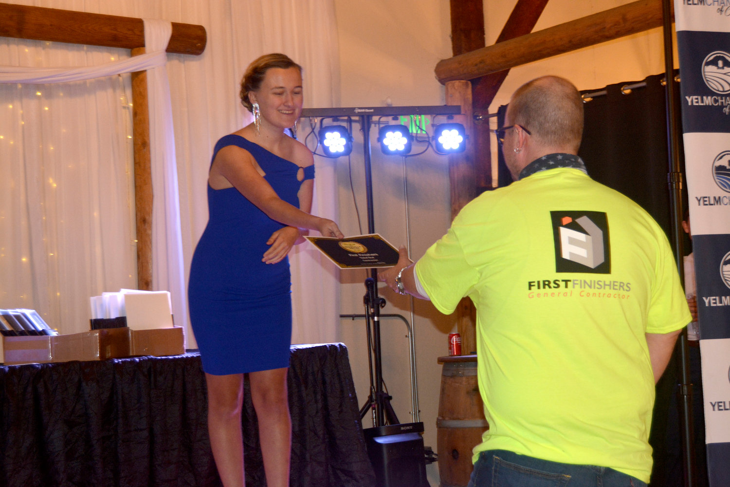 Madison Cahoon delivers an award at the Best of Nisqually  Gala.