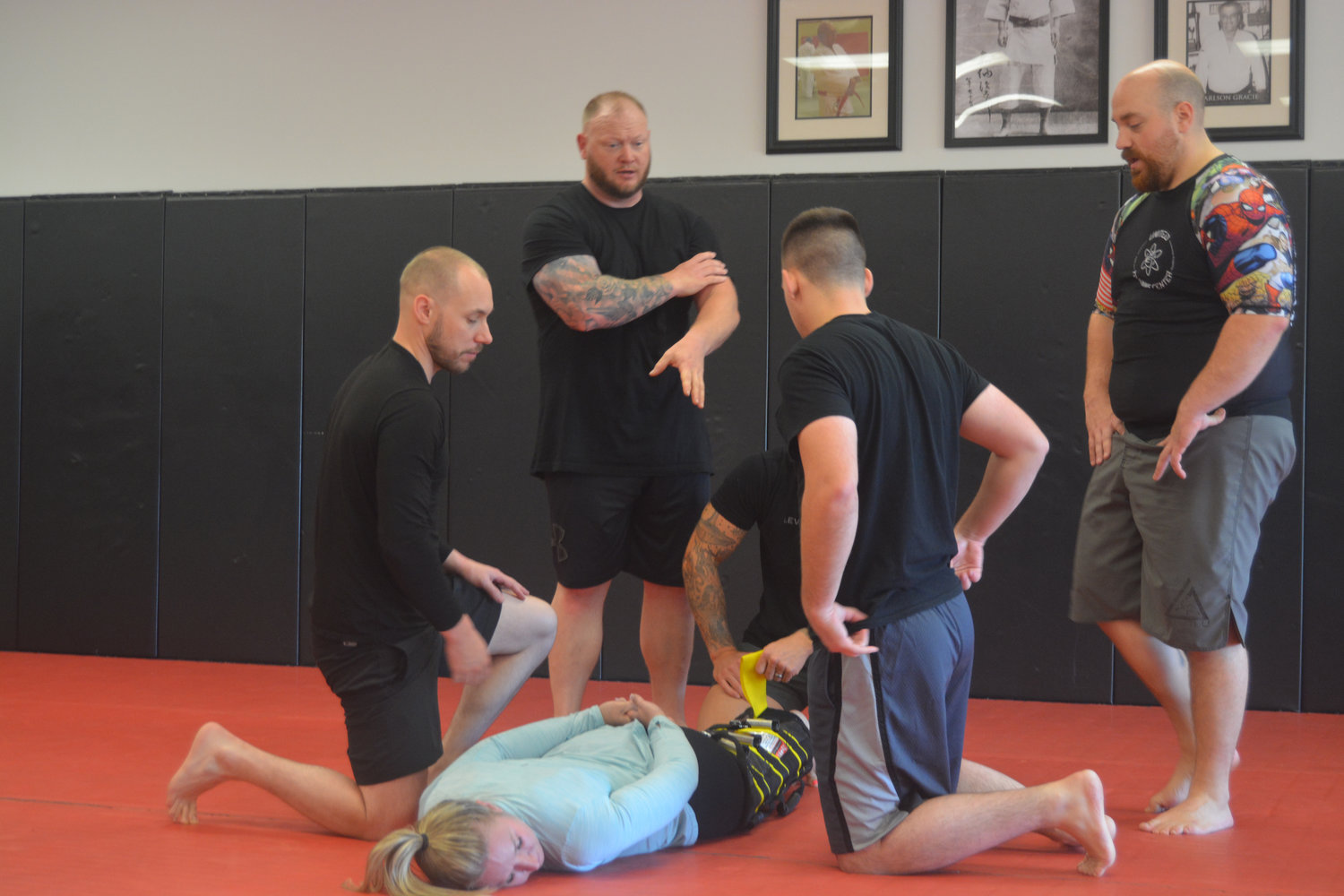 Members of the Yelm Police Department receive instructions on how to properly perform the “wrap” technique at Harai Dojo.