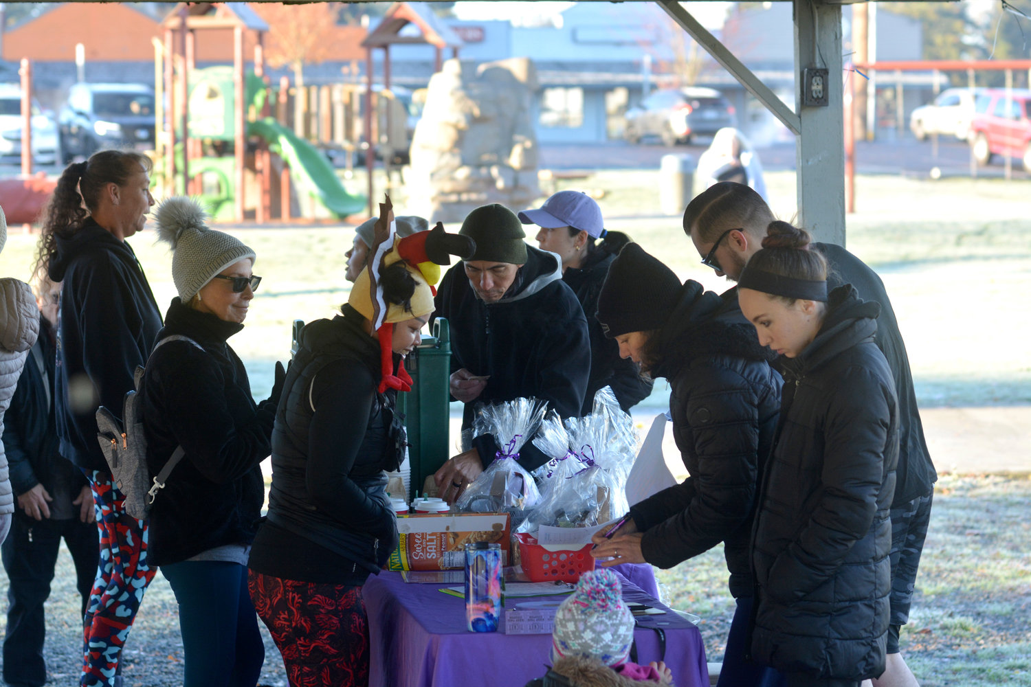 Participants in Yelm Anytime Fitness’s Thanksgiving turkey trot check in prior to the event’s start in this file photo.