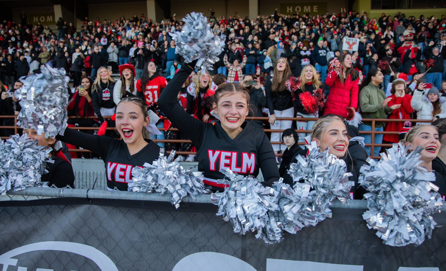 Yelm cheerleaders flash smiles of elation after the football team earned its first 3A State Championship title against Eastside Catholic on Dec. 3 in Puyallup’s Sparks Stadium. A community celebration in honor of the football team is scheduled for Jan. 23.