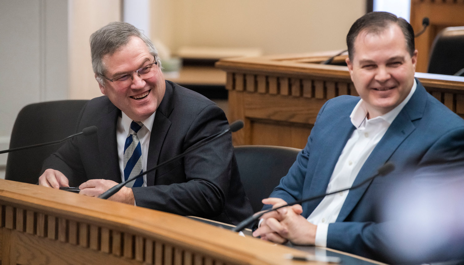 State Rep. J.T. Wilcox, R-Yelm, laughs alongside Sen. John Braun, R-Centralia, while talking to members of the press inside the John A. Cherberg Building in Olympia on Thursday, Jan. 5.