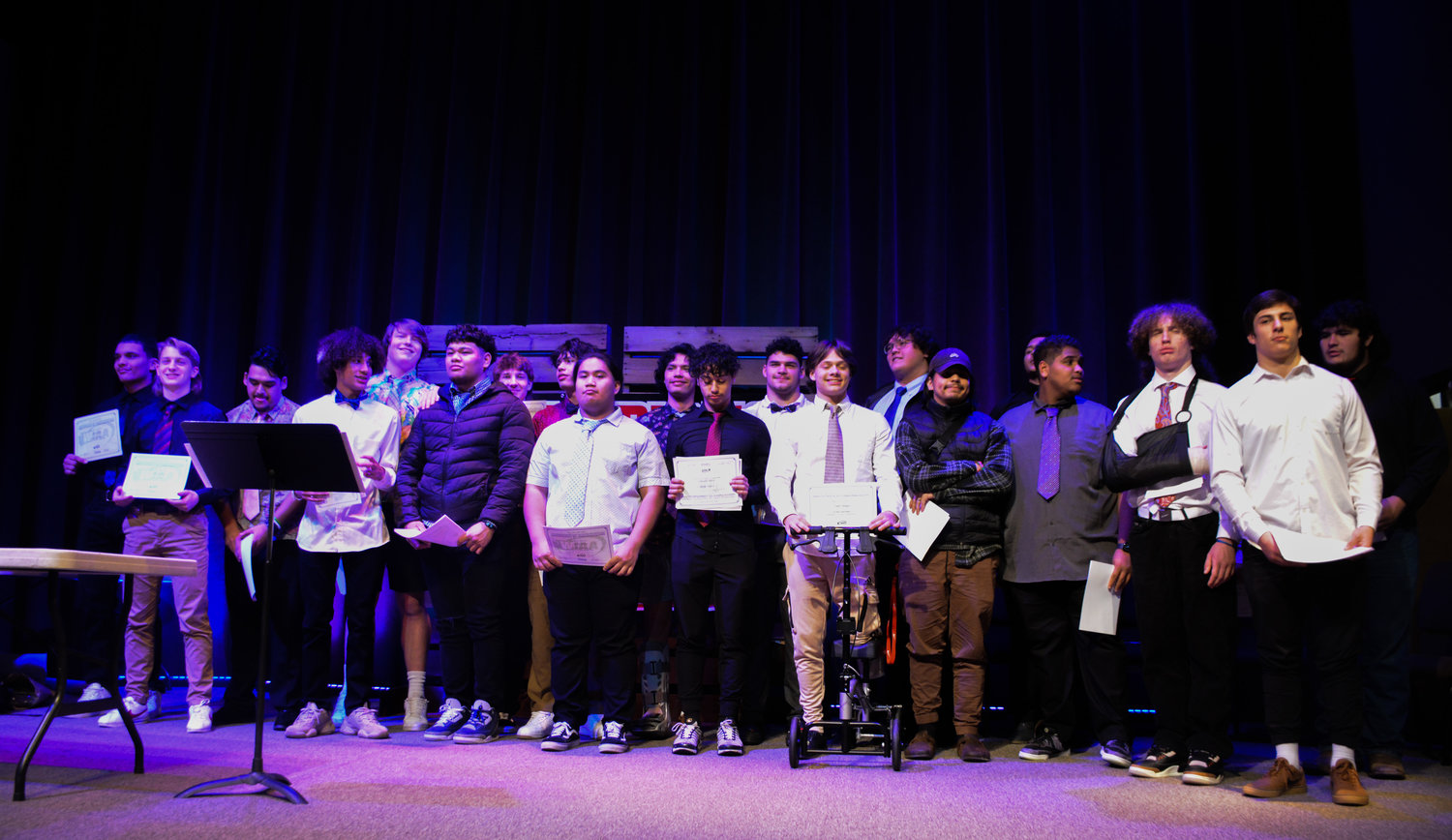 The Tornados varsity football team stands on the stage after they received their varsity letters on Tuesday, Jan. 10.