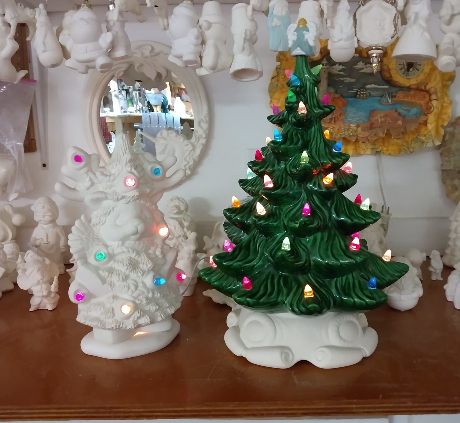 A Christmas tree, and other holiday decorations, are displayed at Out Back Ceramics and Art Studio in Roy, which has been open for 25 years.