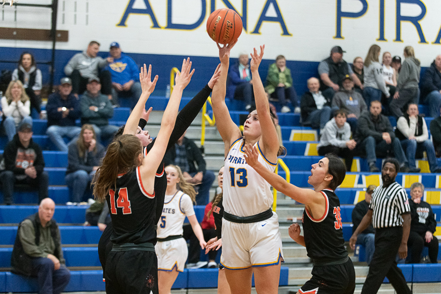 Karlee VonMoos puts up a shot against three defenders during Adna's 51-47 win over Rainier on Jan. 19.