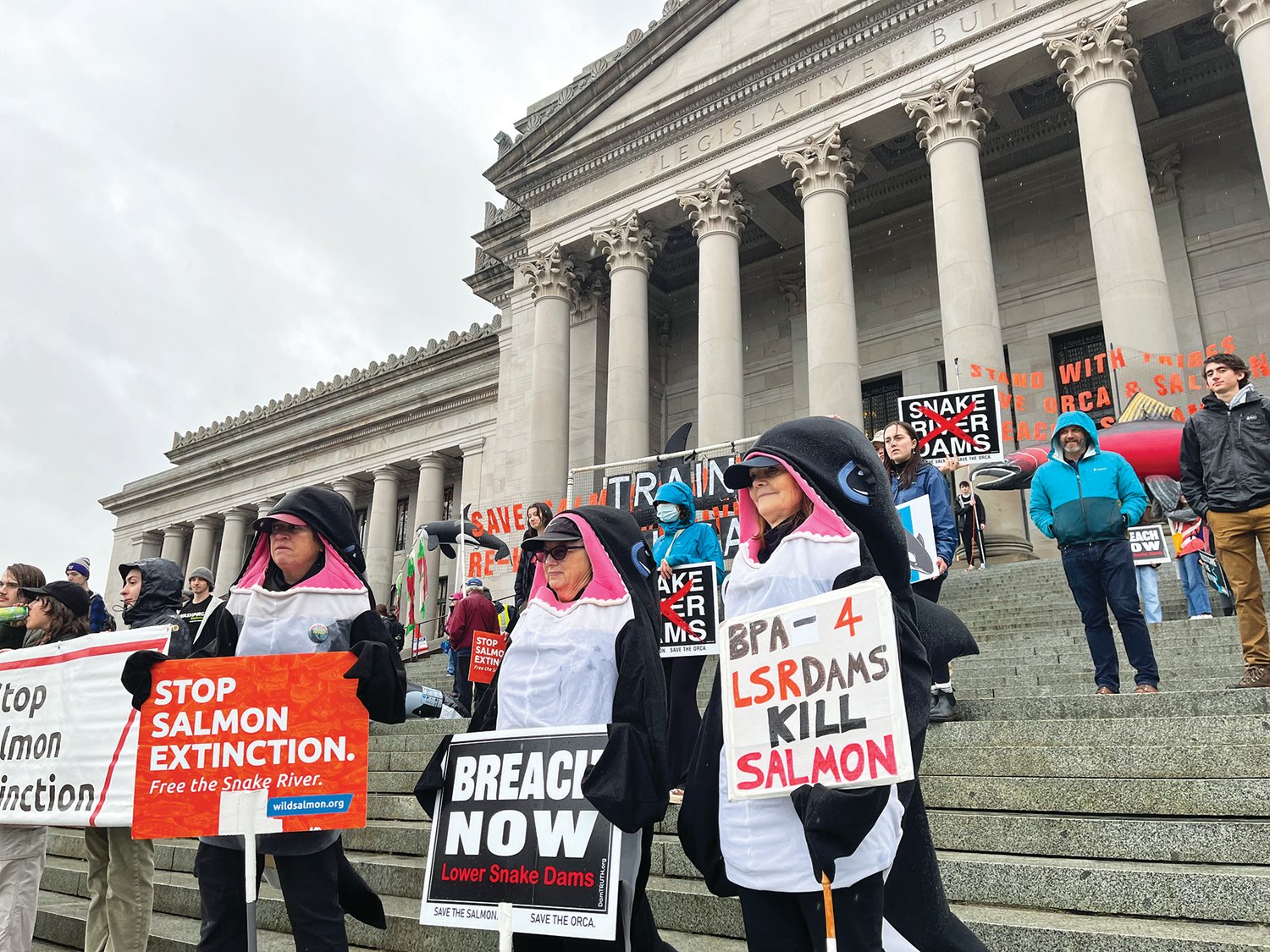 Members of the Washington Youth Ocean and River Conservation Alliance and Earth Ministry Washington Interfaith Power & Light marched from The Olympia Ballroom to the steps of the Capitol on Jan. 13.