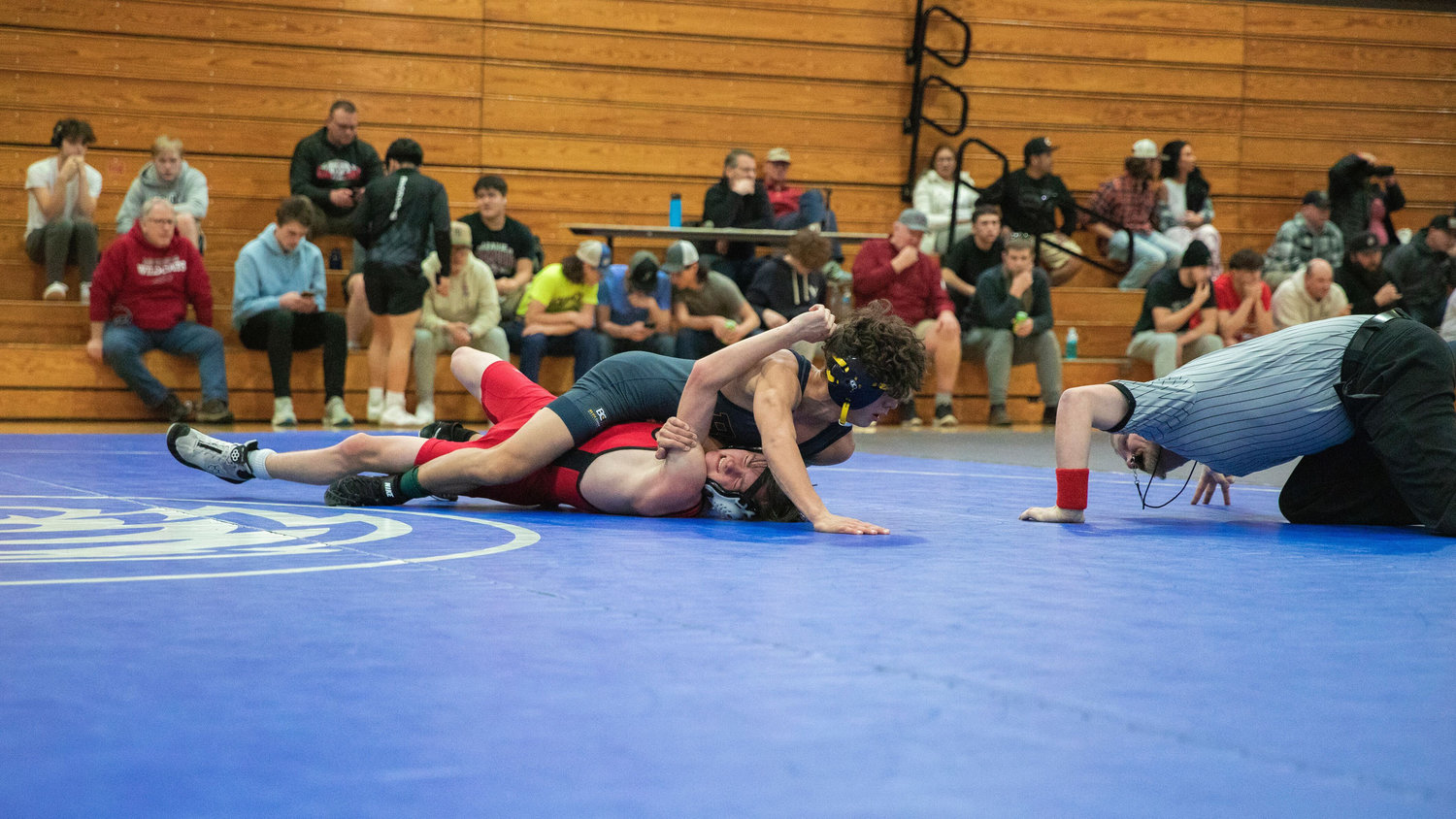Yelm’s Wesley Thompson prepares for impact while wrestling at 113 in Chehalis Saturday night during the Bearcat Invitational.
