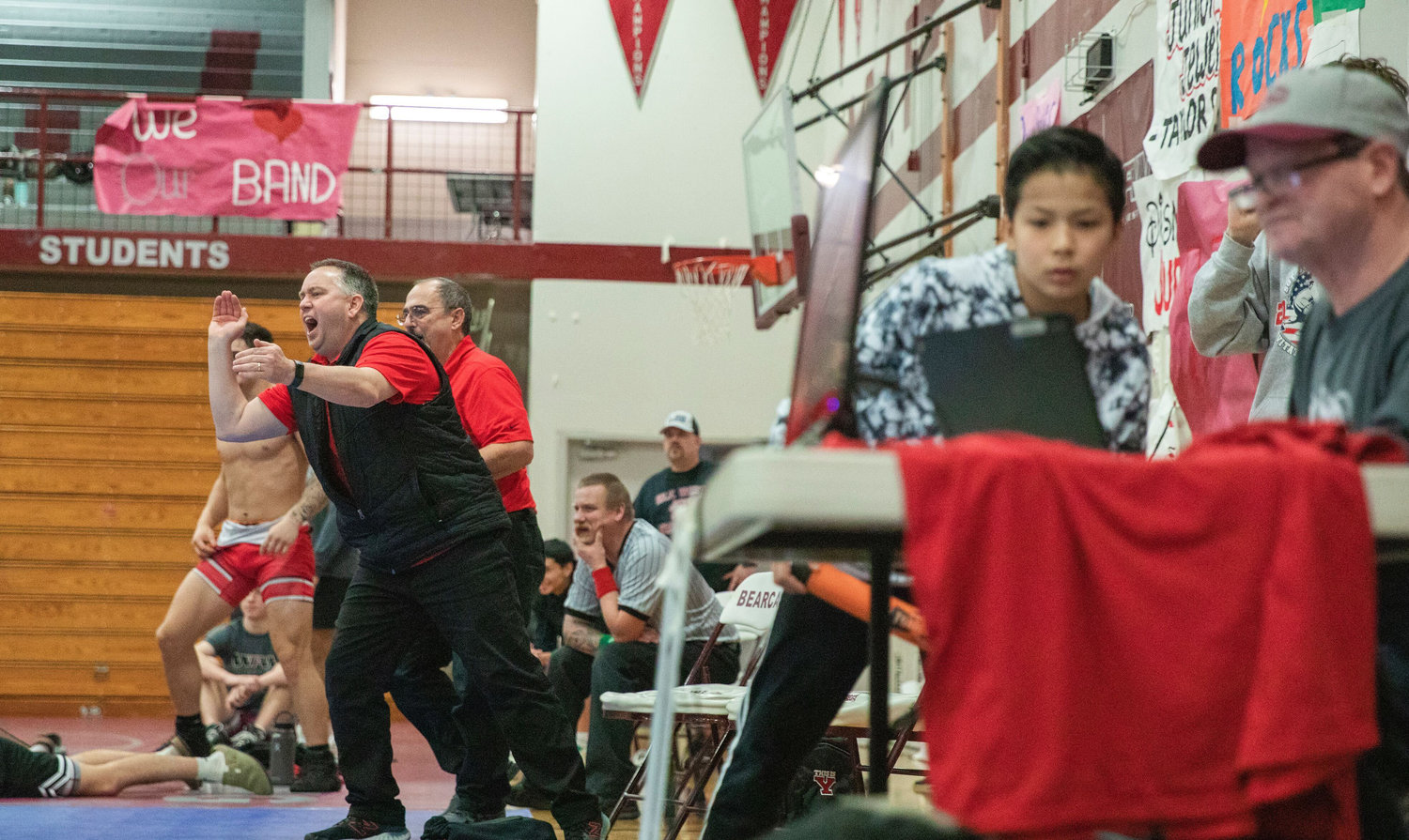 Yelm coaches yell to an athlete wresting in the Bearcat Invitational Saturday night in Chehalis.