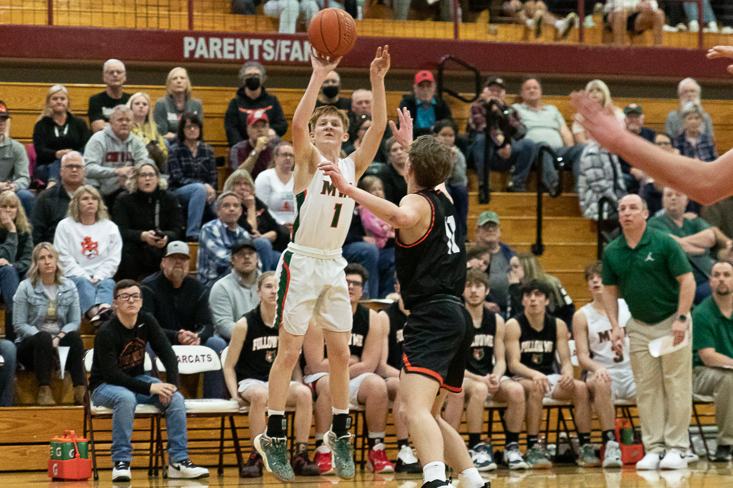 Morton-White Pass guard Jake Cournyer takes a 3-pointer against Rainier in the 2B District 4 quarterfinals at W.F. West Feb. 8.