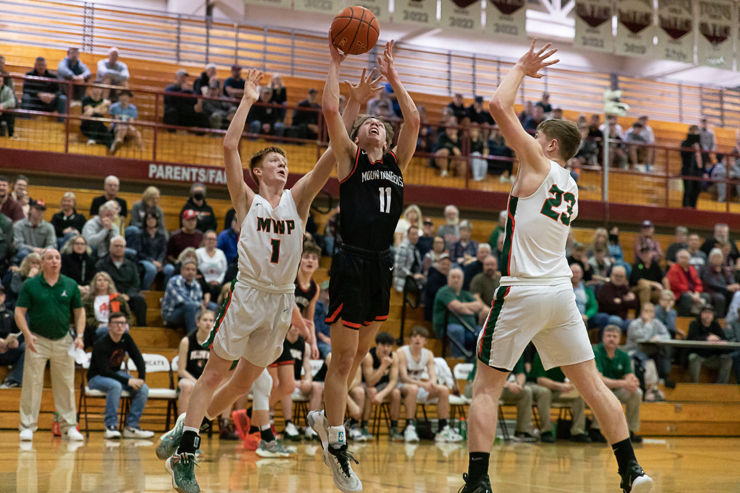 Rainier guard Jimmy Meldrum splits the Morton-White Pass defense for a layup in the 2B District 4 quarterfinals at W.F. West Feb. 8.
