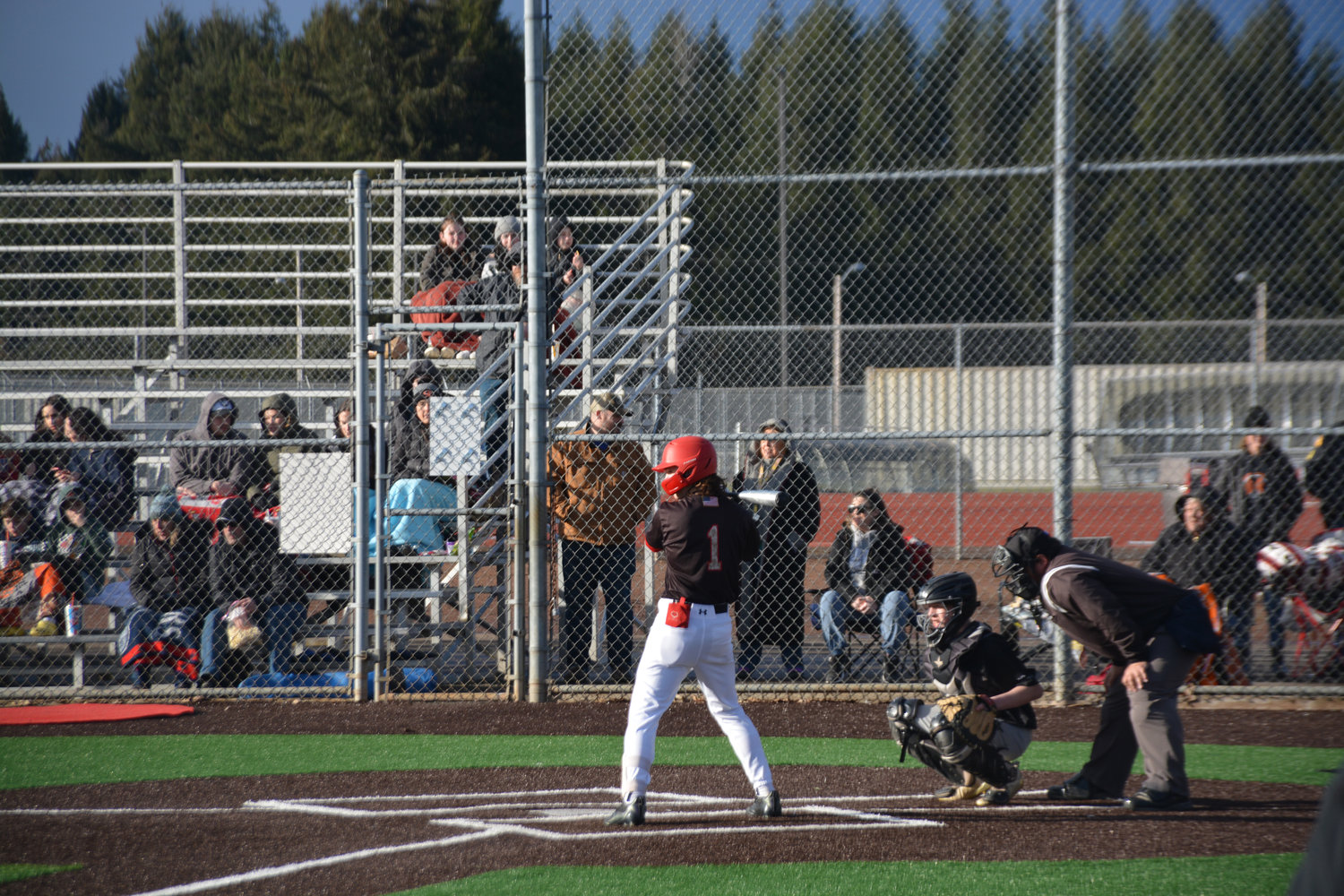 Freshman shortstop Parker Myers awaits the pitch in his debut for Yelm on Friday, March 10.