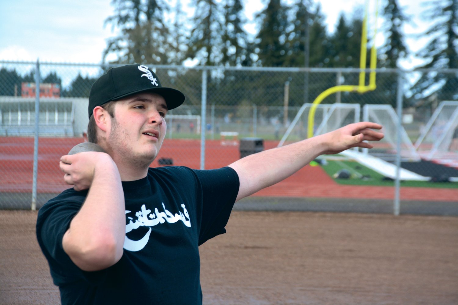 Yelm junior Wyatt DeButts prepares to throw a shot put at practice on Friday, March 10.