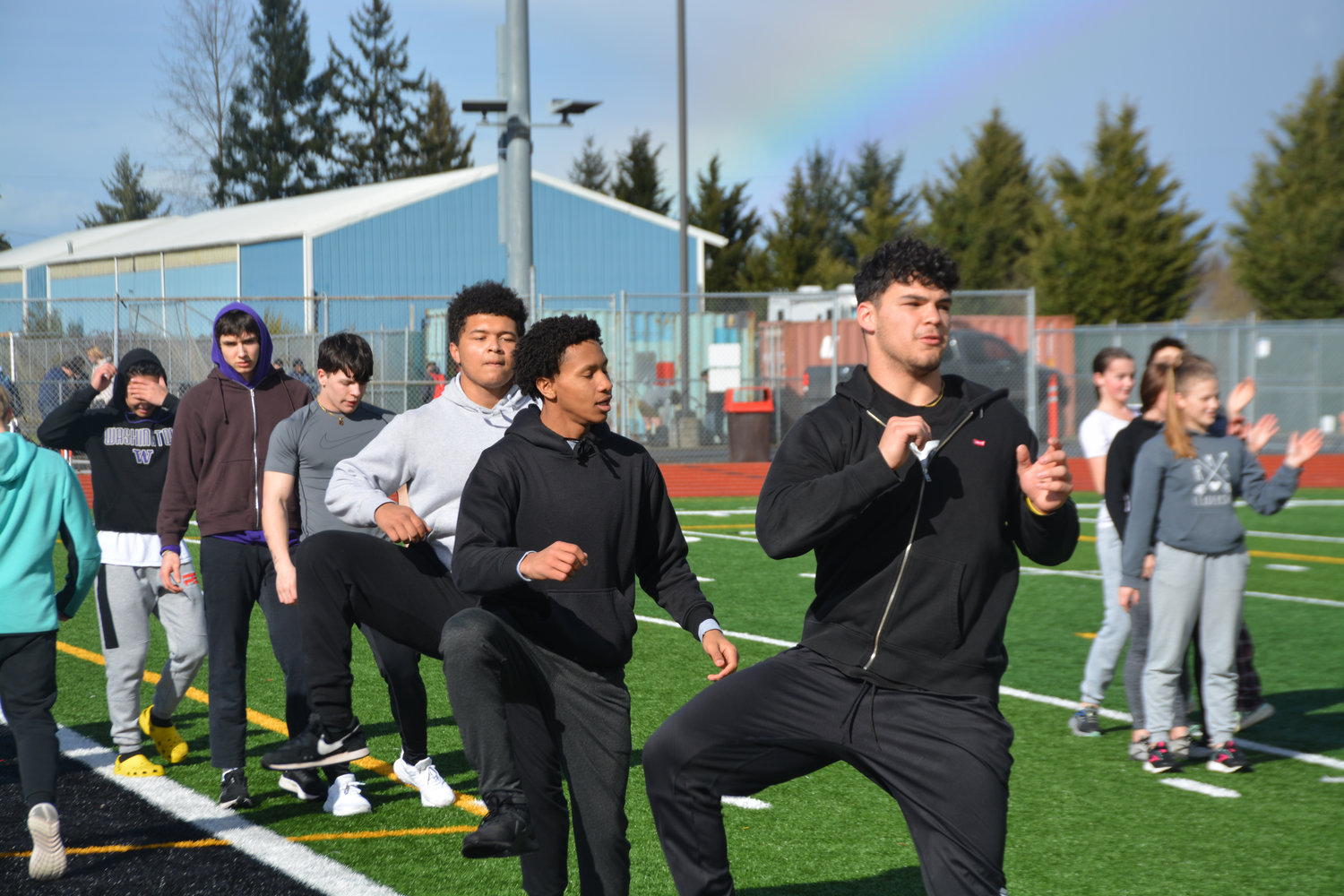 Yelm track athletes warm up on Friday, March 10.