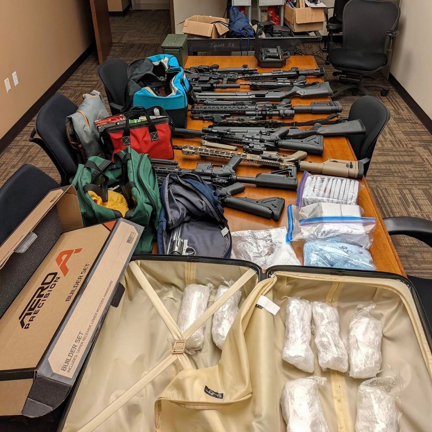 A coordinated arrest and search operation last Wednesday — involving 10 SWAT teams and more than 350 officers — yielded 177 guns, several kilograms of drugs and more than $330,000 in cash from 18 locations in Washington and Arizona.