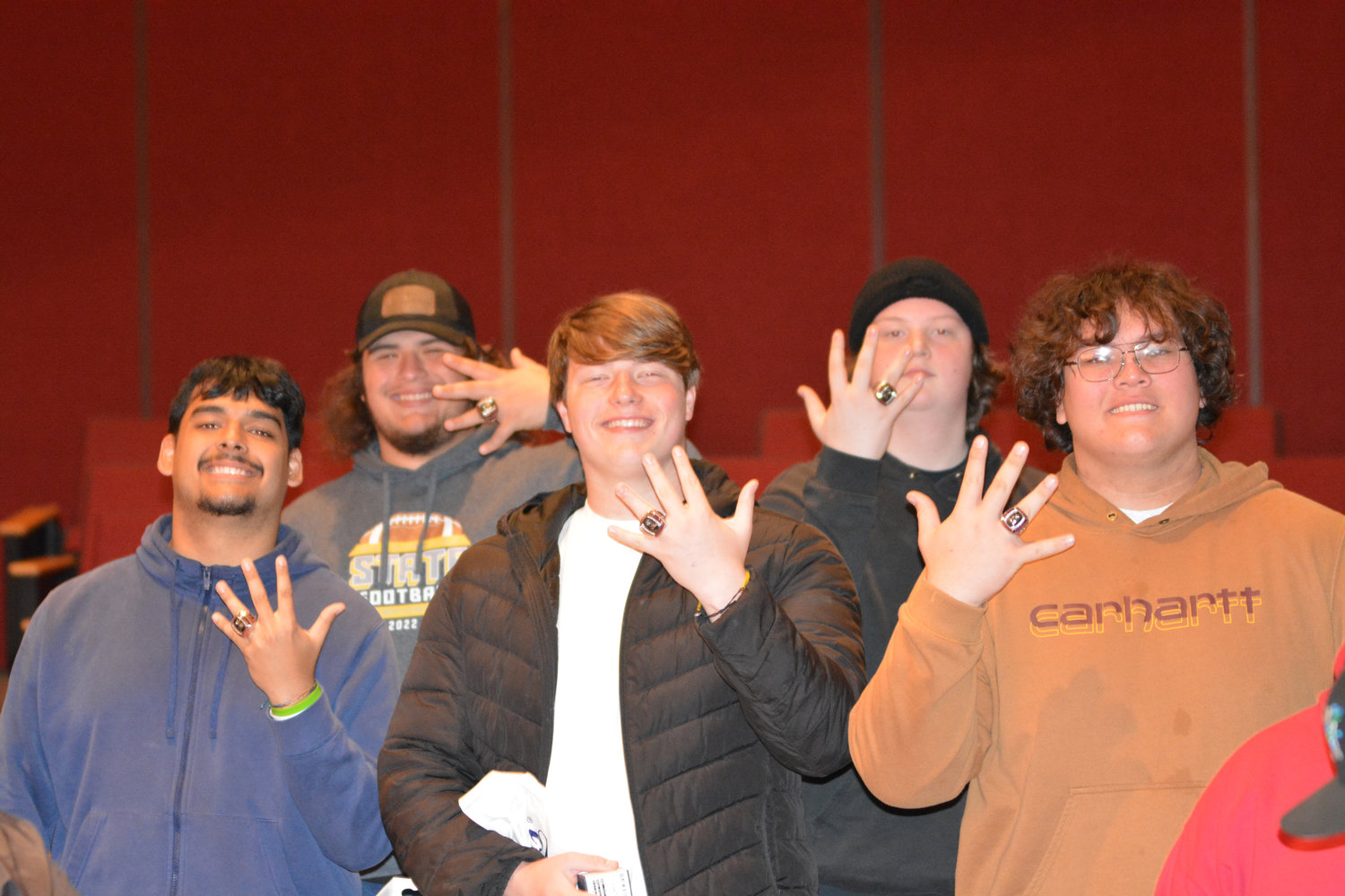 Kyle Kaaiwela, Landen Barger, Tyler Blevins, Shane Creegan and William Snodgrass pose with their new championship rings at Yelm High School on Monday, March 27.