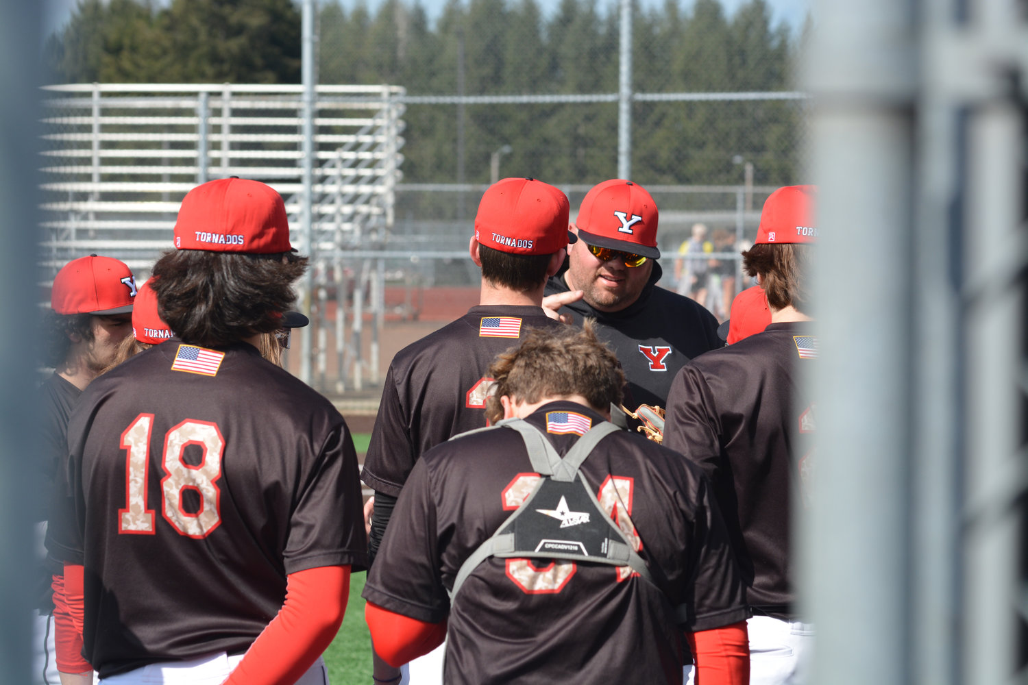 Head Coach Zach Miller addresses his team before they take the field against Gig Harbor on Tuesday, March 21.
