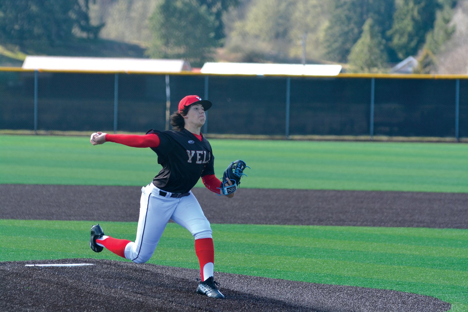 Freshman Landan Halterman delivers a pitch against Gig Harbor at home on Tuesday, March 21.