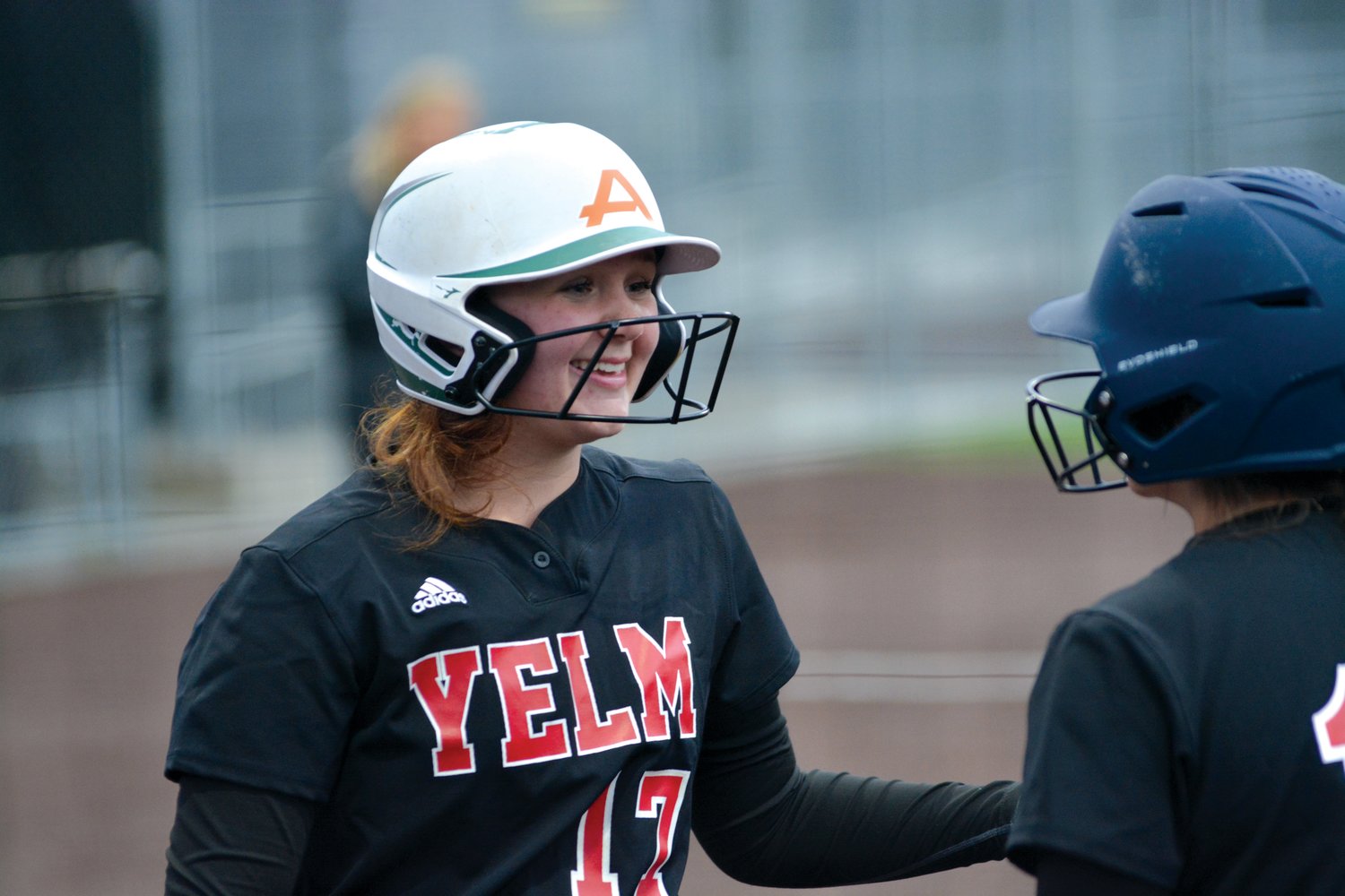 Caylee Roberts smiles before her at-bat against Ellensburg High School on Friday, March 24.