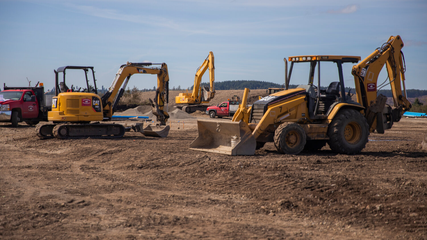 Excavators and backhoes are seen on the construction site of an agricultural park along Old Highway 99 SE in Tenino on Thursday, April 27, 2023.
