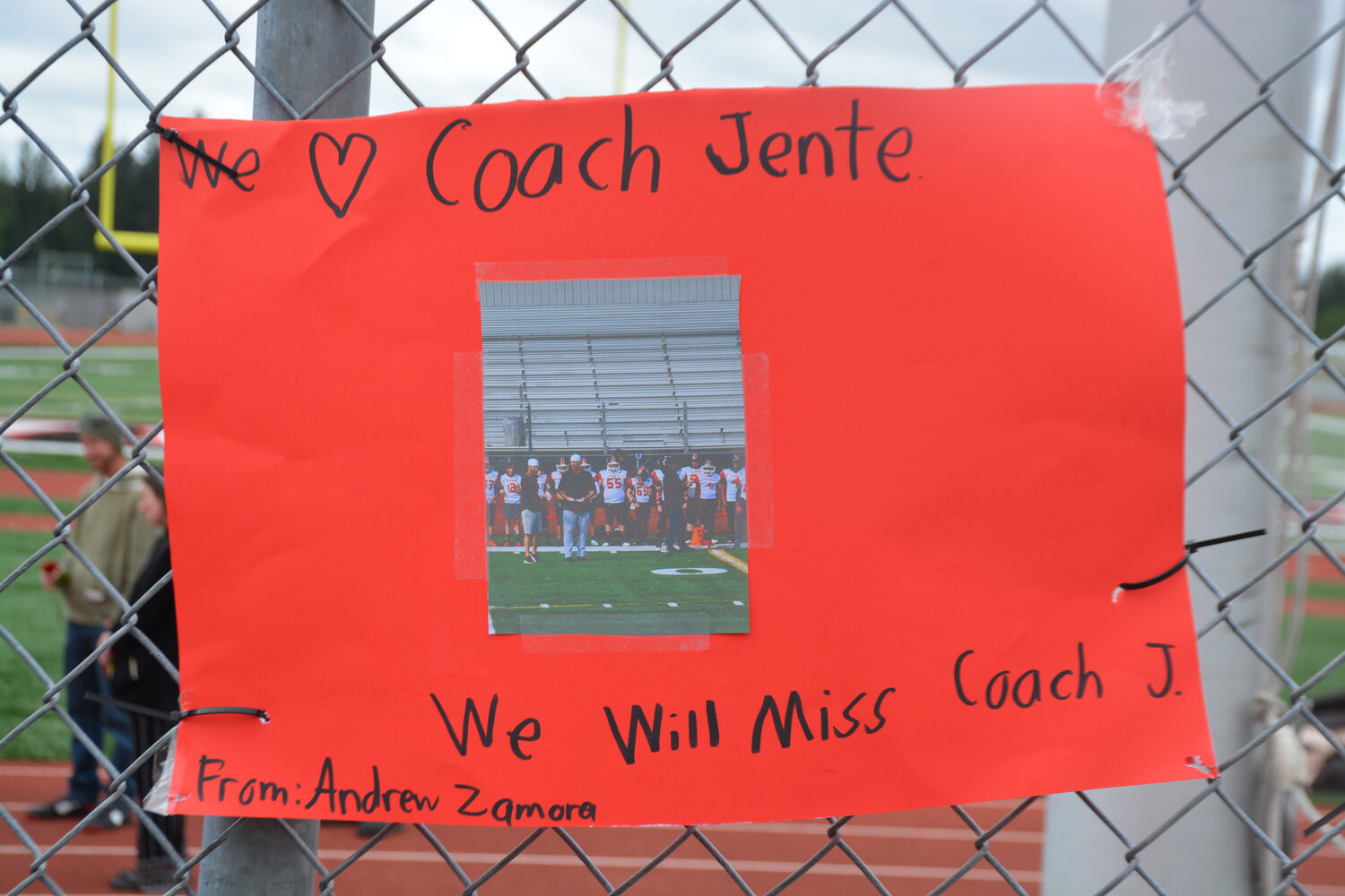 A sign made by athlete Andrew Zamora hangs outside of the Yelm High School football field.