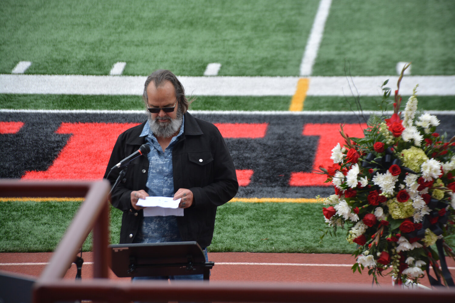 Dwayne McCarver shares his memories of Shawn Jemtegaard at  a memorial at Yelm High School on May 21.
