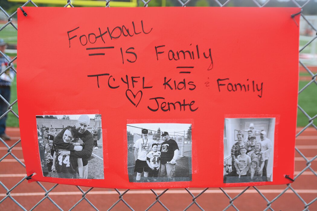 A sign made in support of the Jemtegaard family hangs on a fence at the Yelm High School field on Sunday, May 21.