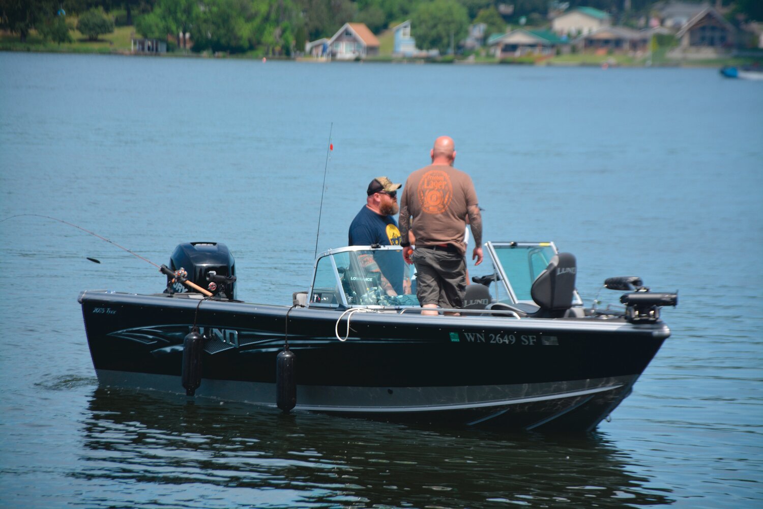 Participants take to the water to learn how to fish at Lake Lawrence on Saturday, May 20.